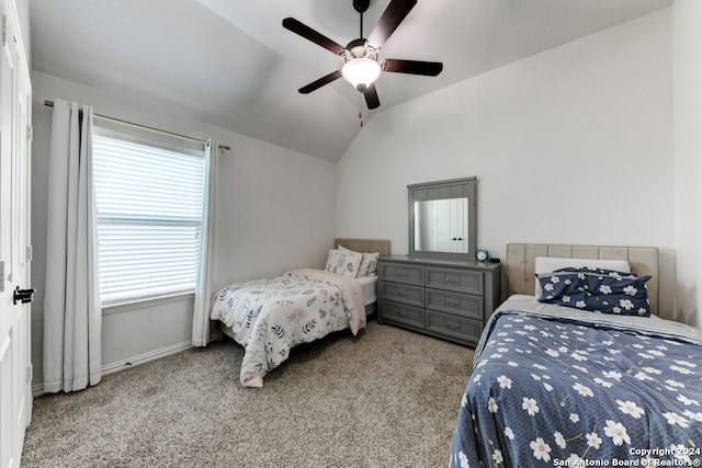 bedroom featuring ceiling fan, lofted ceiling, and light colored carpet