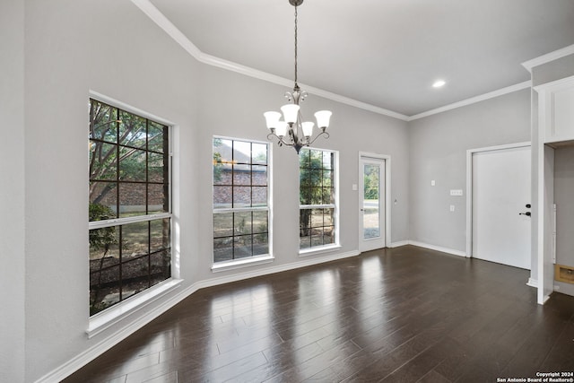 unfurnished dining area with ornamental molding, a notable chandelier, and dark hardwood / wood-style flooring