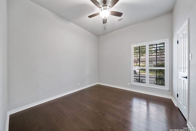 unfurnished room featuring dark hardwood / wood-style flooring and ceiling fan