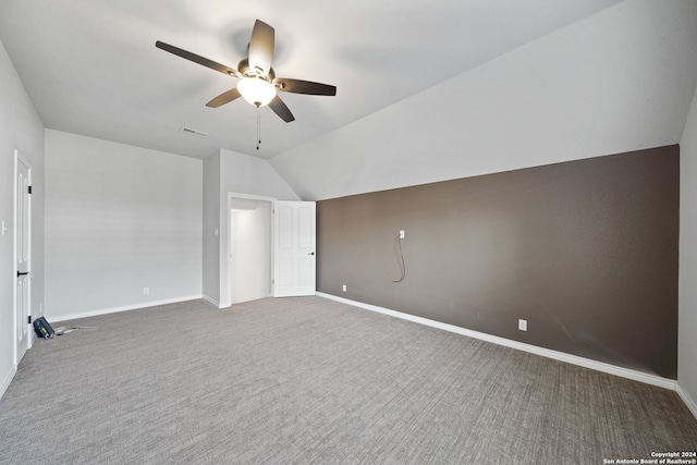 additional living space featuring carpet floors, lofted ceiling, and ceiling fan