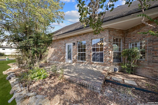 rear view of house with a patio