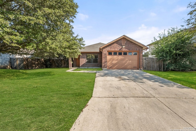 view of front of property with a garage and a front yard