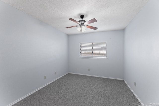 spare room featuring ceiling fan, carpet floors, and a textured ceiling