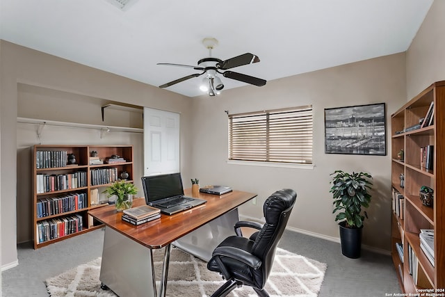 office with light colored carpet and ceiling fan