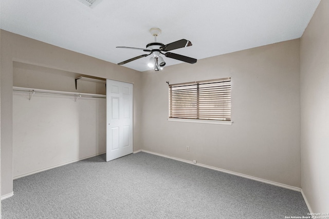 unfurnished bedroom with ceiling fan, a closet, and carpet