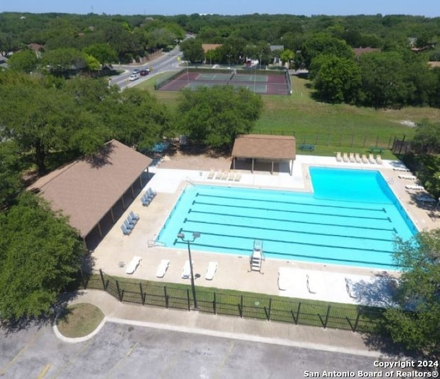 view of pool with a yard and a patio area