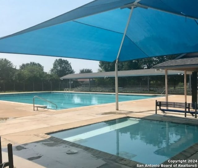 view of pool with a patio area