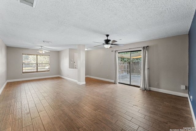 unfurnished room with ceiling fan, wood-type flooring, and a textured ceiling