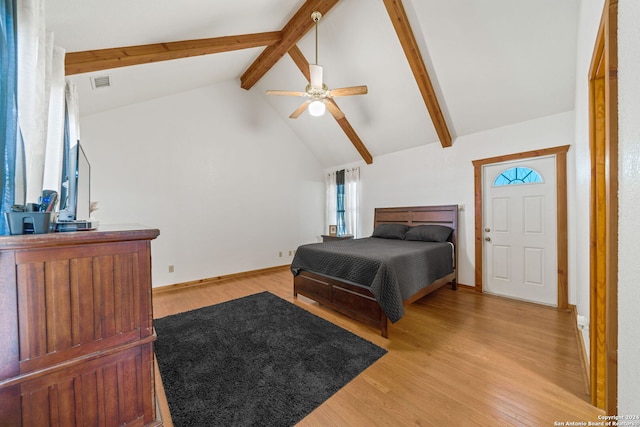 bedroom with ceiling fan, light wood-type flooring, beam ceiling, and high vaulted ceiling