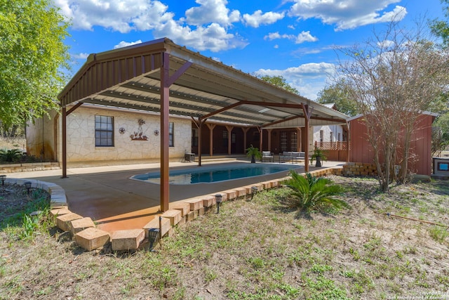 view of swimming pool featuring a patio area