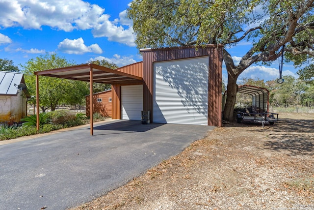 exterior space with a carport and a garage