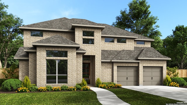 view of front of house with a front lawn and a garage