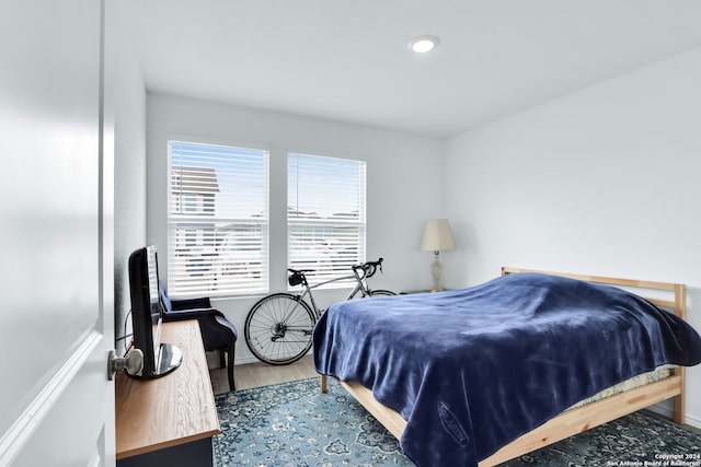 bedroom featuring hardwood / wood-style floors