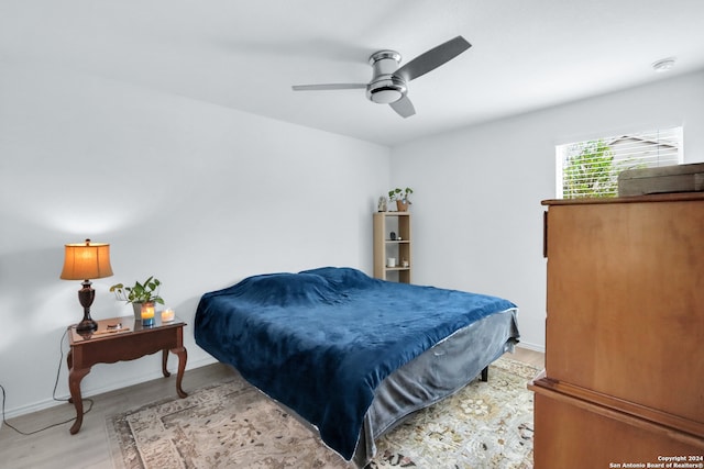 bedroom featuring ceiling fan and light hardwood / wood-style floors