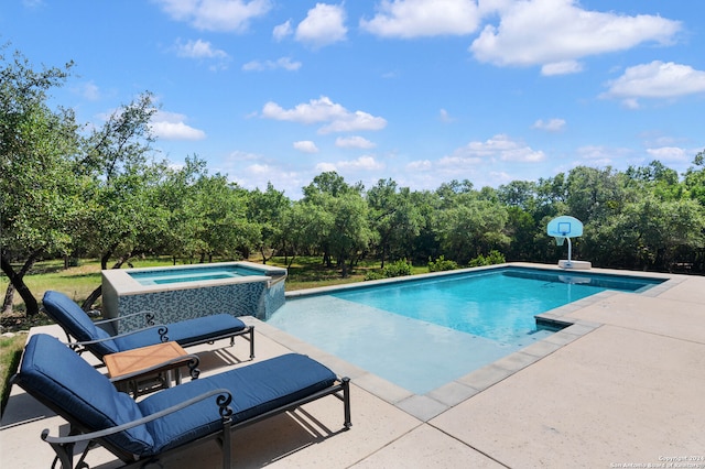 view of pool featuring an in ground hot tub and a patio area