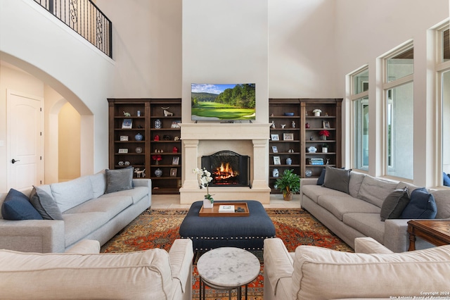 living room featuring a high ceiling