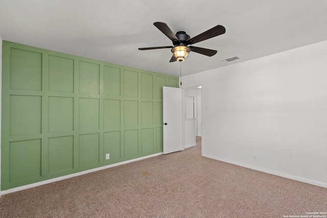 carpeted empty room with ceiling fan