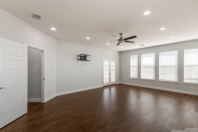 spare room with french doors, dark hardwood / wood-style floors, and ceiling fan