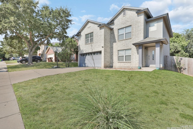 view of front facade featuring a garage and a front lawn