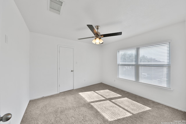 unfurnished room featuring carpet floors and ceiling fan