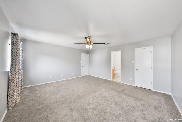 spare room featuring carpet flooring and ceiling fan