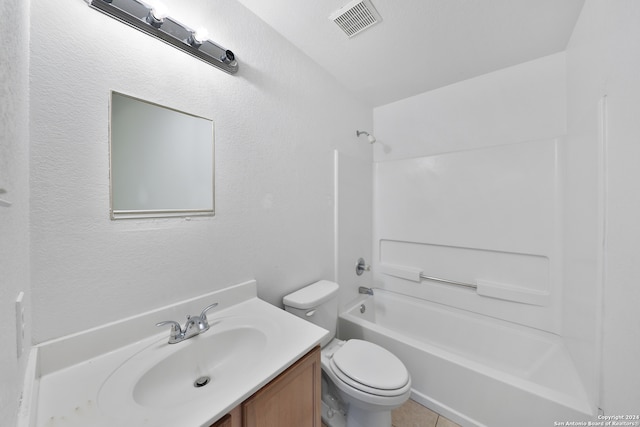 full bathroom featuring tile patterned flooring, shower / washtub combination, vanity, and toilet