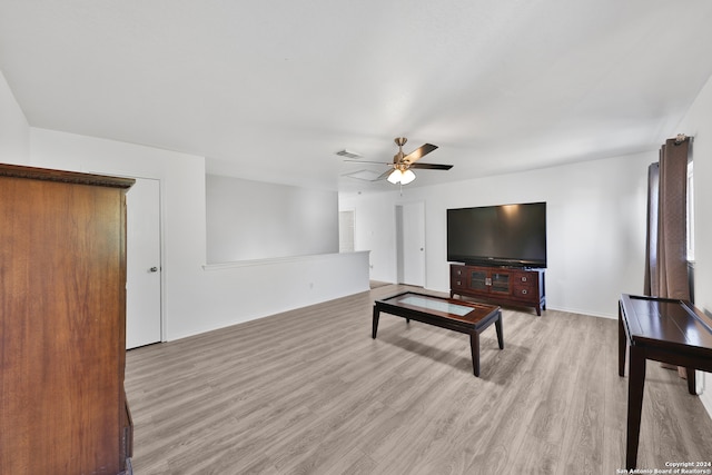 living room with light hardwood / wood-style floors and ceiling fan