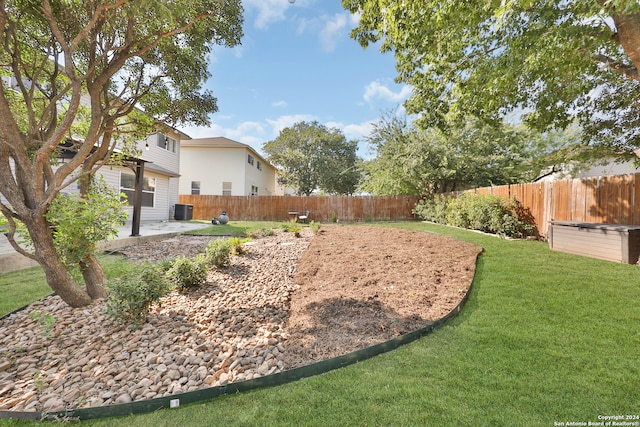 view of yard with a patio and central AC