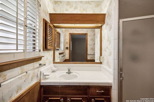 bathroom with vanity and an enclosed shower