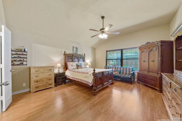 bedroom with lofted ceiling, ceiling fan, and light hardwood / wood-style flooring