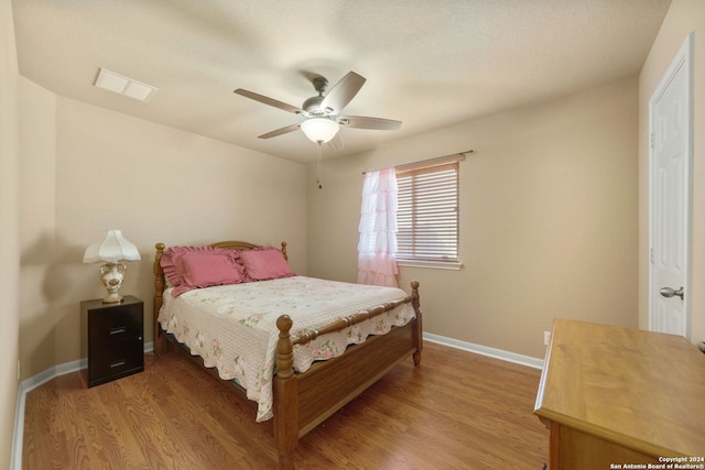 bedroom featuring ceiling fan and light hardwood / wood-style floors