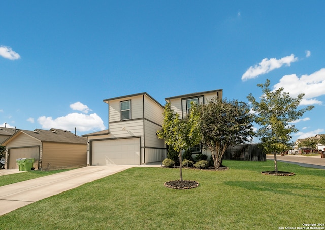 view of front of home with a front lawn and a garage