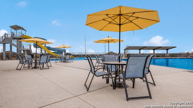 view of patio / terrace featuring a community pool