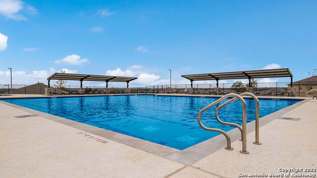 view of swimming pool featuring a patio area