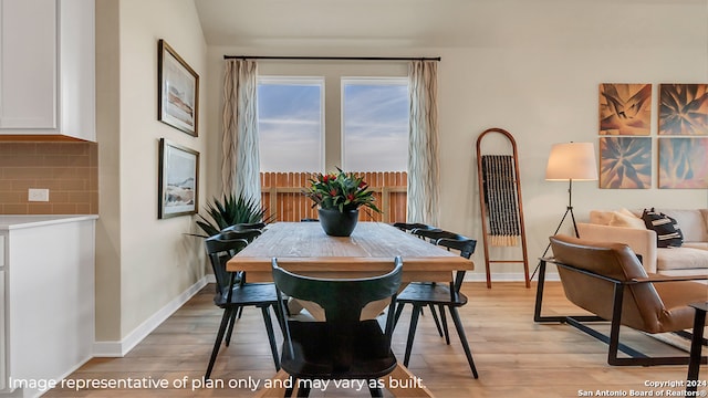 dining area featuring light wood-type flooring