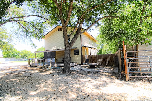 rear view of property with a wooden deck