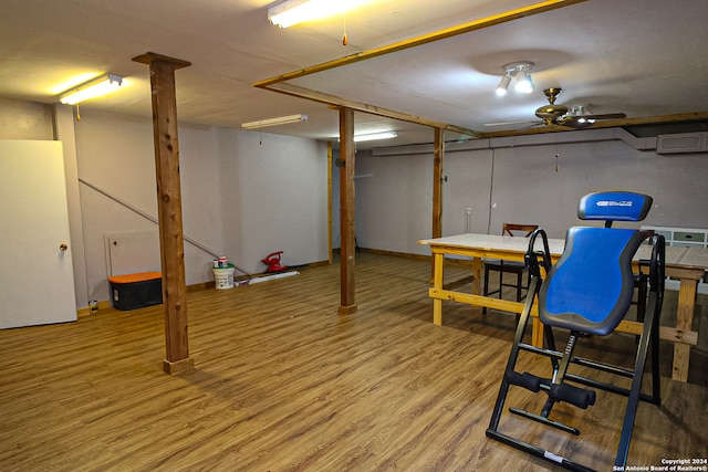 basement featuring ceiling fan and hardwood / wood-style flooring