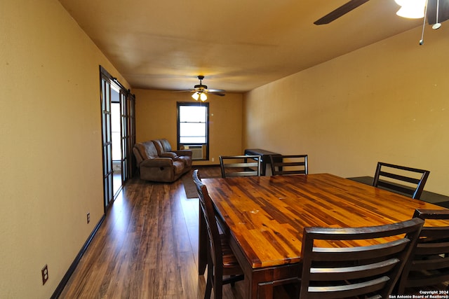 dining space with dark hardwood / wood-style flooring and ceiling fan