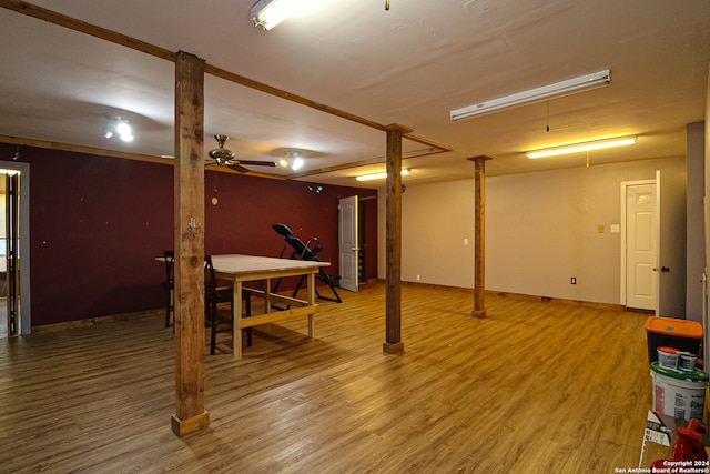 basement with hardwood / wood-style flooring and ceiling fan