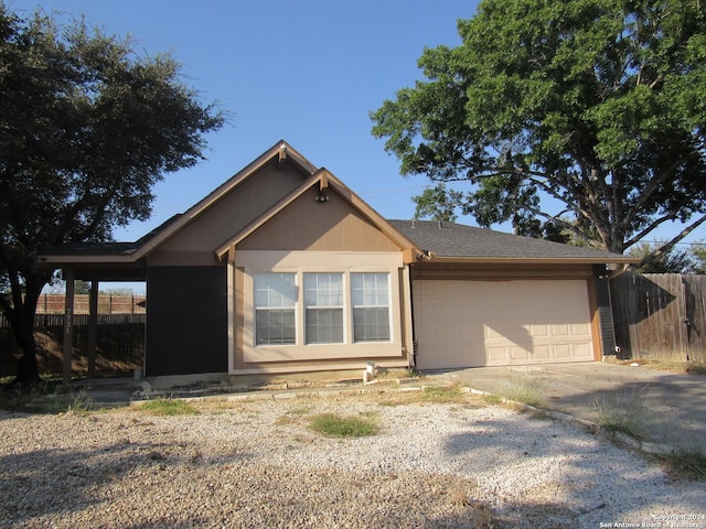 7731 Clear Ridge Dr, San Antonio, TX 78239 - view of side of property featuring concrete driveway, fence, and a garage