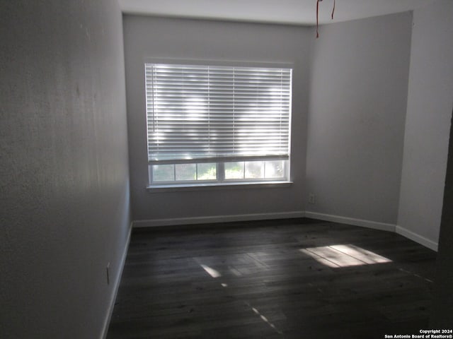 empty room featuring dark hardwood / wood-style floors