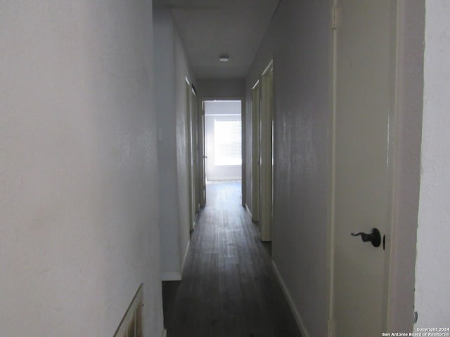 7731 Clear Ridge Dr, San Antonio, TX 78239 - corridor with baseboards and dark wood finished floors