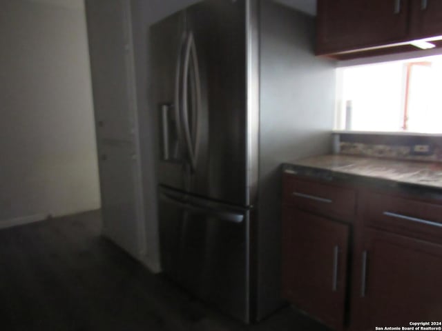 kitchen featuring stainless steel refrigerator with ice dispenser