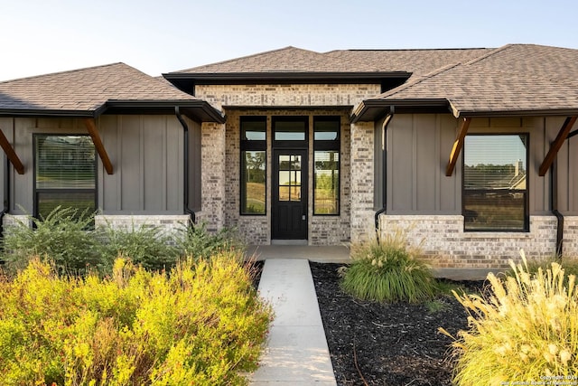 view of exterior entry featuring a porch