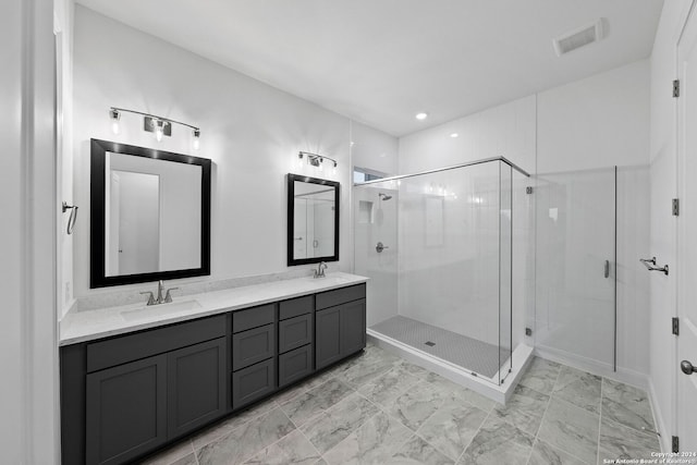 bathroom featuring an enclosed shower and vanity