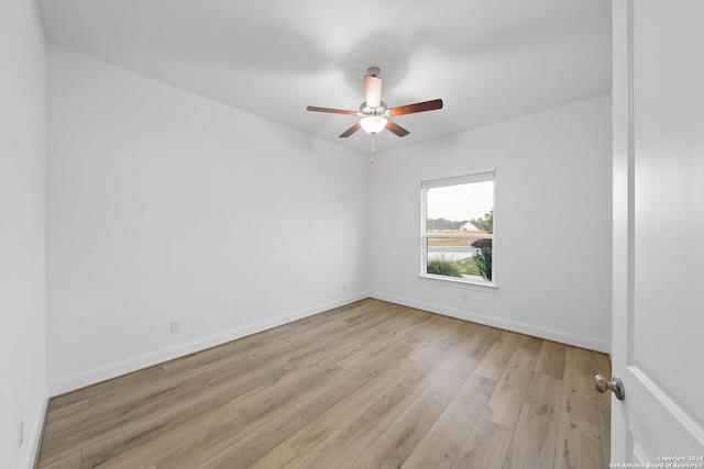 unfurnished room with ceiling fan and light hardwood / wood-style flooring