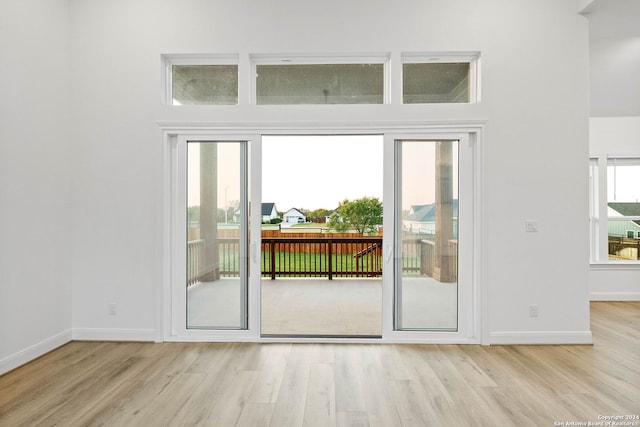 doorway to outside with light wood-type flooring