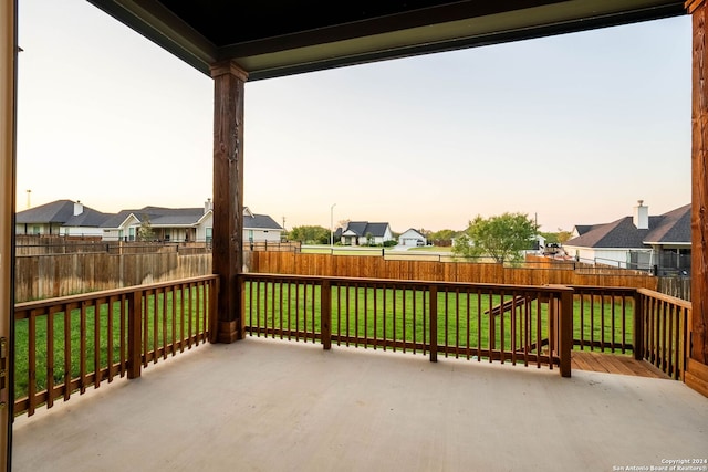 patio terrace at dusk with a lawn