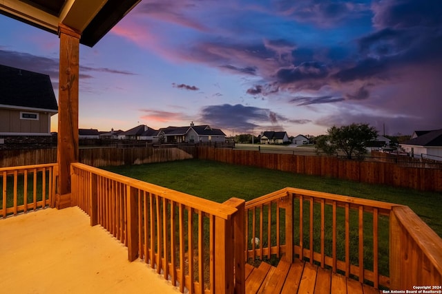 deck at dusk with a yard