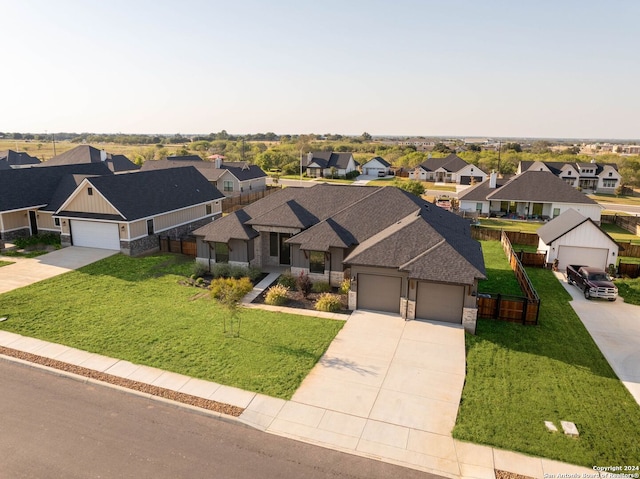 view of front of property featuring a garage and a front yard